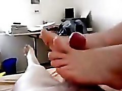 Amateur girl giving a foot job