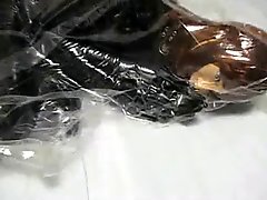 Girl with Rubber Mask in Vacuum Bag