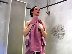 One brunette surprise under its shower