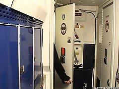 Horny couple fucking in the lavatory of an airplane while stewardess jills off