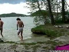 Two dudes bang oldie near lake