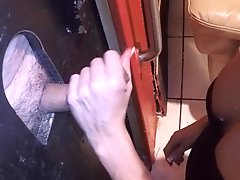 Wifey milking some cocks at the gloryhole