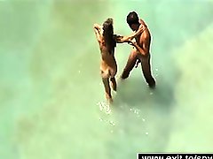 Beautiful horny nudist couples in the surf on the sea