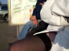 Girl in stockings at the bus stop