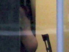 Hot chick nude in window voyeur Grey Bldg