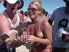 Palpitating amateurs in sexy bikini getting drunk at a beach party outdoor