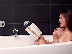 Tania Funes reads in the bathroom and takes a bath