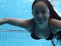 Long hair brunette teen with small tits swims