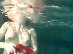Girl strips from her bikini underwater