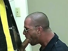 Nasty fire-fighter shoves his dirty cock in the mouth of police officer