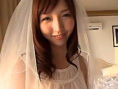 OHTSUKA Mae Wedding dress on the bed