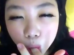 Amateur asian girl tasting herself