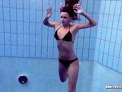 Bikini teen takes off her top in the pool