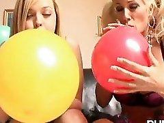 Alexis Texas and Puma Swede blowing a balloons