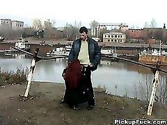 Redhead student sucks on the banks of the river for all to see