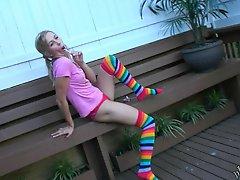 Naughty Kasia in thigh high socks and panties having fun outside