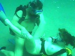Busty girl having underwater sex with her man