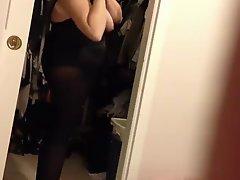 Wife putting on the black girdle