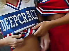 Cheerleaders do each other before a cock is added for a kick ass threesome