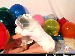 2 Beautiful teens play wearing diapers in their bedroom