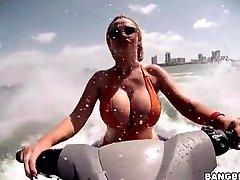 Nikki Benz blows a guy in the ocean
