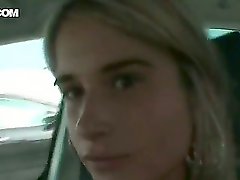 Attractive beauty Nessa Devil with long blonde hair and steaming hot tight body in regular clothes gets filmed in close up while driving in car and shopping at the supermarket.